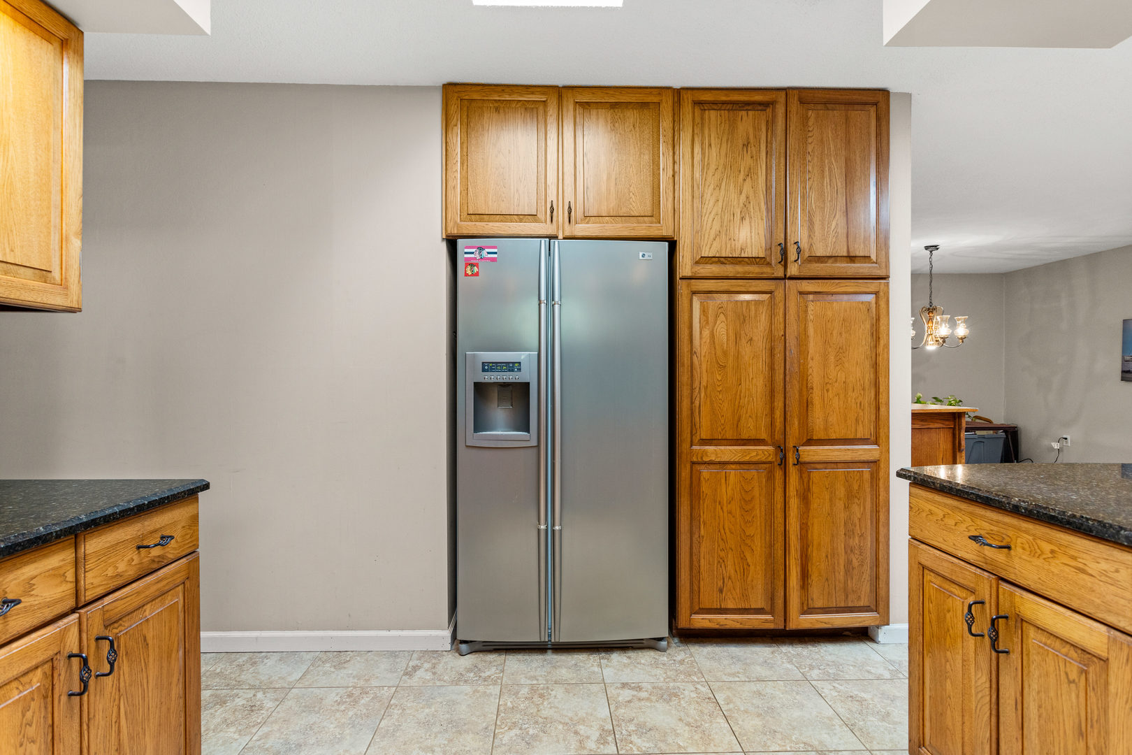 2073 Coyote Run Road Monticello, IL 61856 - Photo 14 of 42 a view of a kitchen with a refrigerator and cabinets