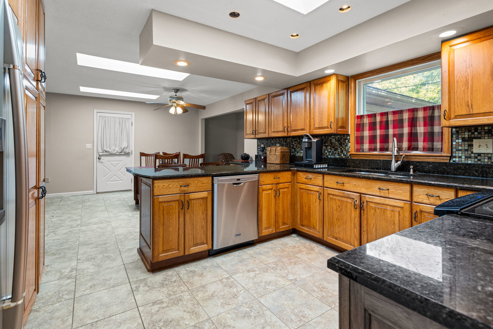 2073 Coyote Run Road Monticello, IL 61856 - Photo 15 of 42 a kitchen with stainless steel appliances granite countertop a sink stove and cabinets