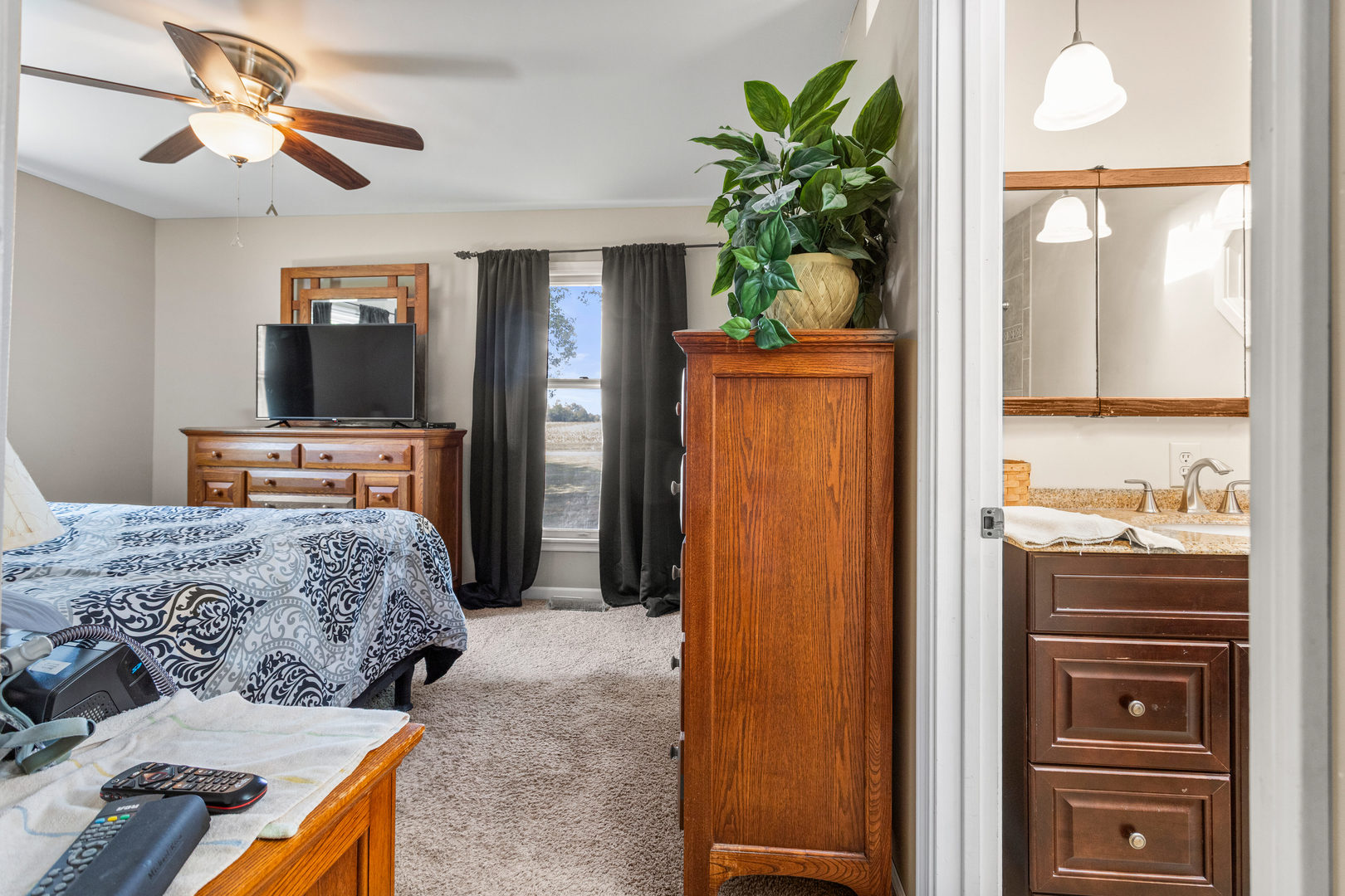 2073 Coyote Run Road Monticello, IL 61856 - Photo 19 of 42 a bedroom with a bed and a television