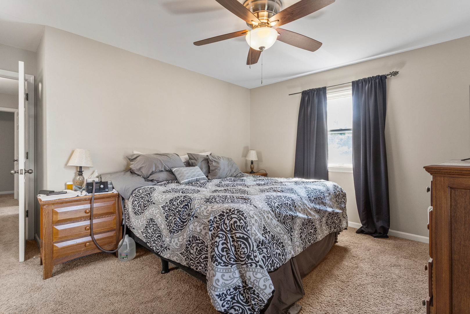 2073 Coyote Run Road Monticello, IL 61856 - Photo 20 of 42 a bedroom with a bed and a chandelier