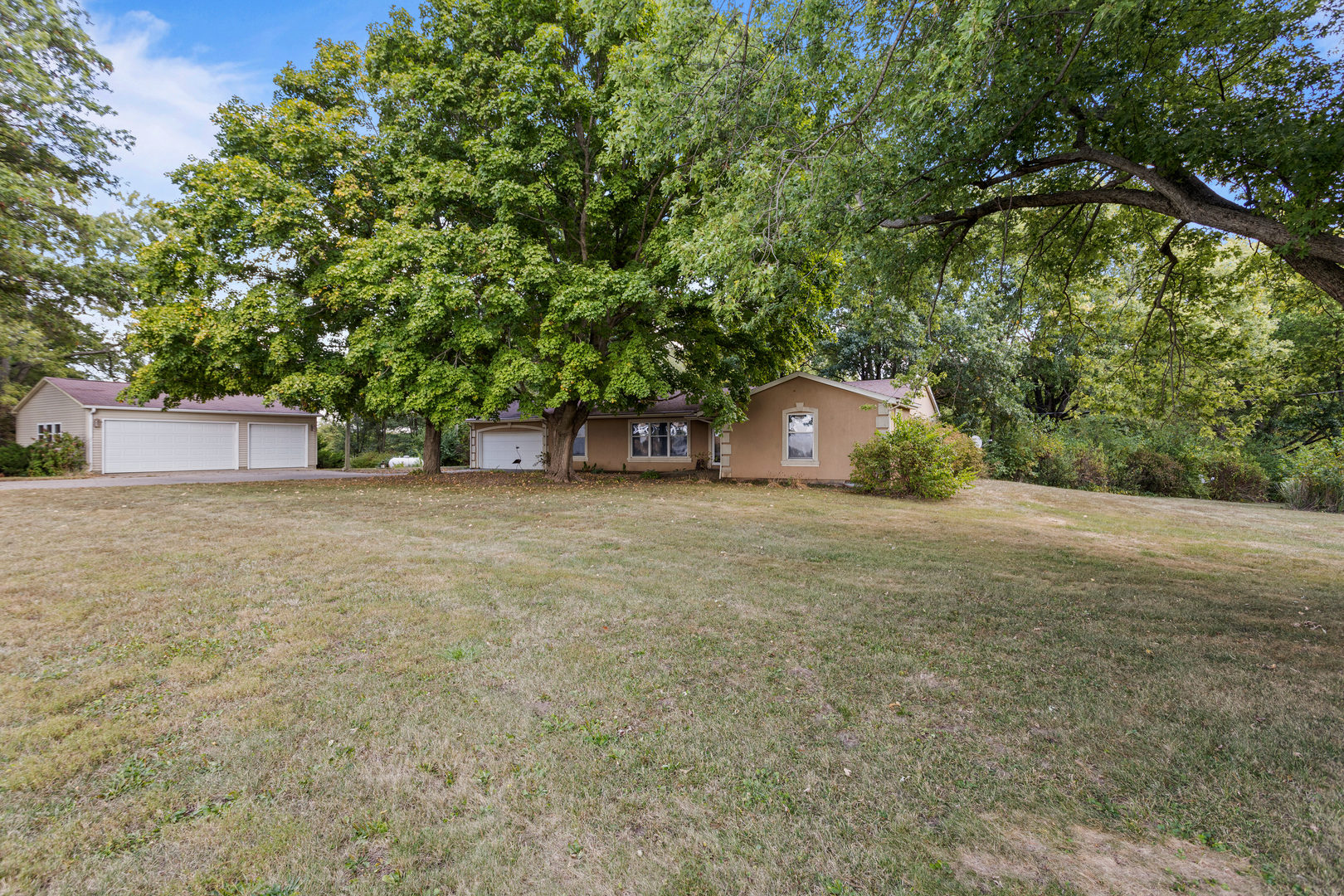 2073 Coyote Run Road Monticello, IL 61856 - Photo 2 of 42 a house with trees in front of it