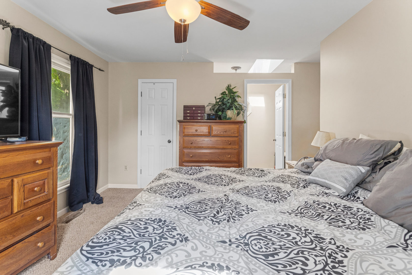 2073 Coyote Run Road Monticello, IL 61856 - Photo 21 of 42 a bedroom with a bed and a dresser