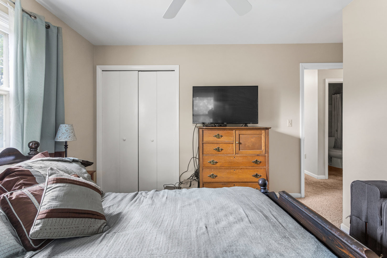 2073 Coyote Run Road Monticello, IL 61856 - Photo 30 of 42 a bedroom with a bed and flat screen tv