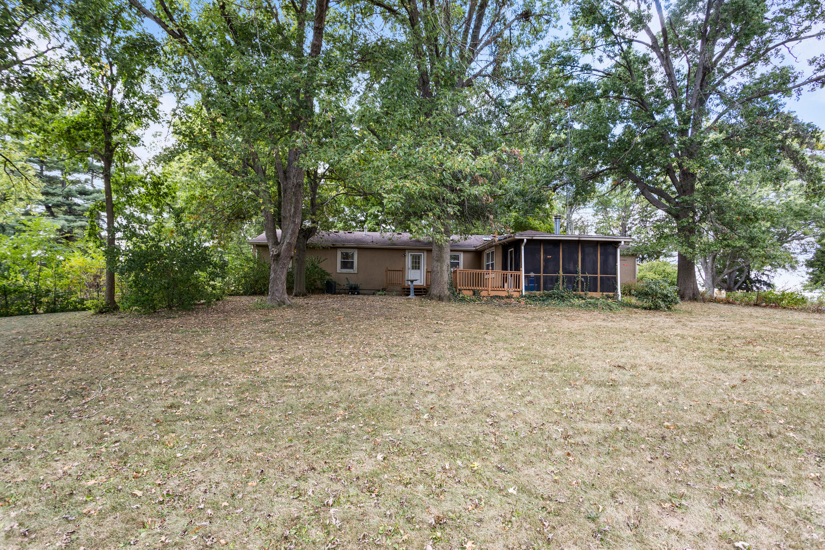 2073 Coyote Run Road Monticello, IL 61856 - Photo 34 of 42 a house with trees in front of it