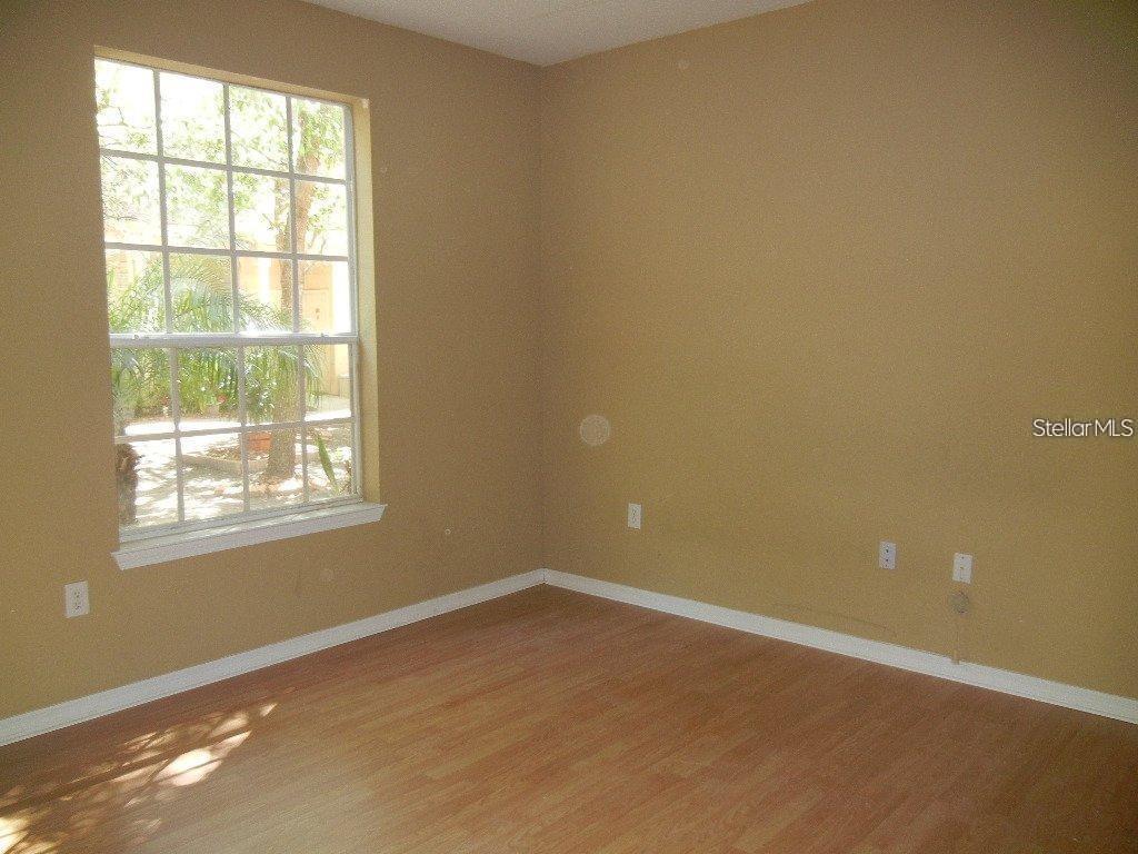 873 Grand Regency Pointe, Unit 105 Altamonte Springs, FL 32714 - Photo 12 of 24 an empty room with a window