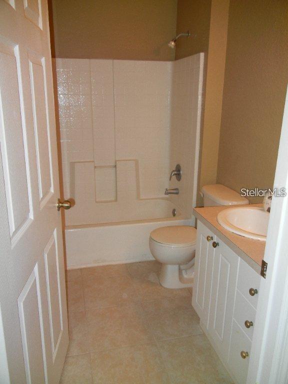 873 Grand Regency Pointe, Unit 105 Altamonte Springs, FL 32714 - Photo 17 of 24 a bathroom with a toilet a sink and a bathtub