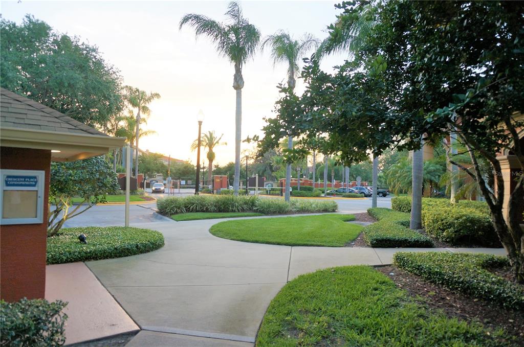 873 Grand Regency Pointe, Unit 105 Altamonte Springs, FL 32714 - Photo 3 of 24 a view of a garden with palm trees