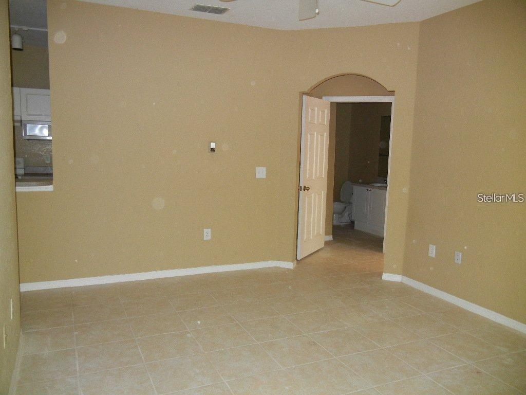 873 Grand Regency Pointe, Unit 105 Altamonte Springs, FL 32714 - Photo 6 of 24 an empty room with a bathroom
