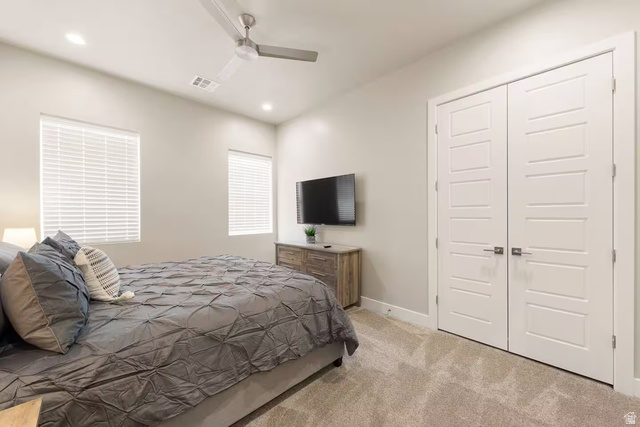 2600 Ocotillo Way, Unit 56 Santa Clara, UT 84765 - Photo 15 of 33 Bedroom featuring light colored carpet, a closet, ceiling fan, and recessed lighting