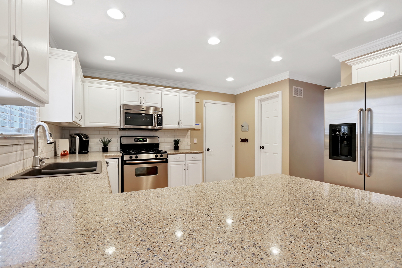 4665 Middle Road Gurnee, IL 60031 - Photo 14 of 46 a kitchen with stainless steel appliances granite countertop a refrigerator and a stove top oven