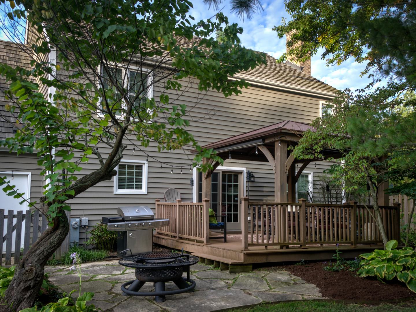 4665 Middle Road Gurnee, IL 60031 - Photo 3 of 46 a front view of a house with a garden