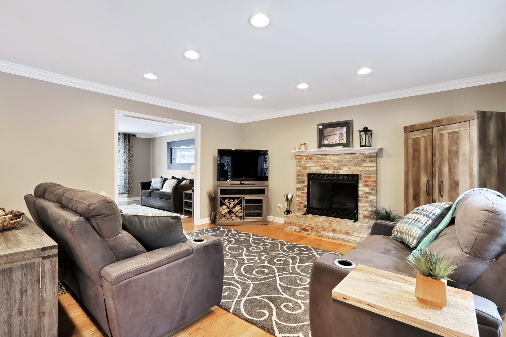 4665 Middle Road Gurnee, IL 60031 - Photo 10 of 46 a living room with furniture a flat screen tv and a fireplace