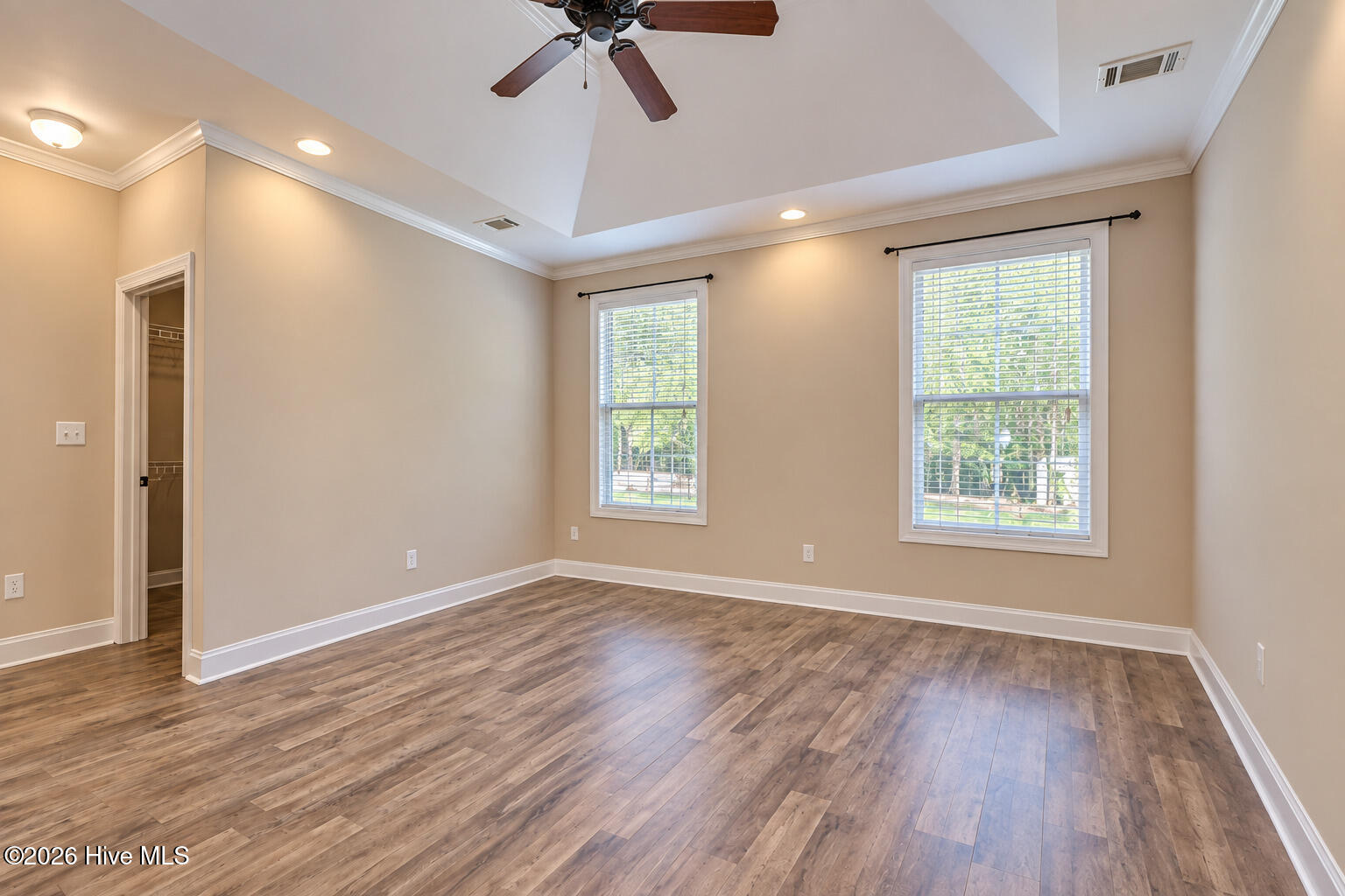 3523 Deerfield Road Dearing, GA 30808 - Photo 18 of 39 The main-level owner’s suite offers a relaxing retreat with a tray ceiling, dual vanities, walk-in shower and an oversized walk-in closet.
