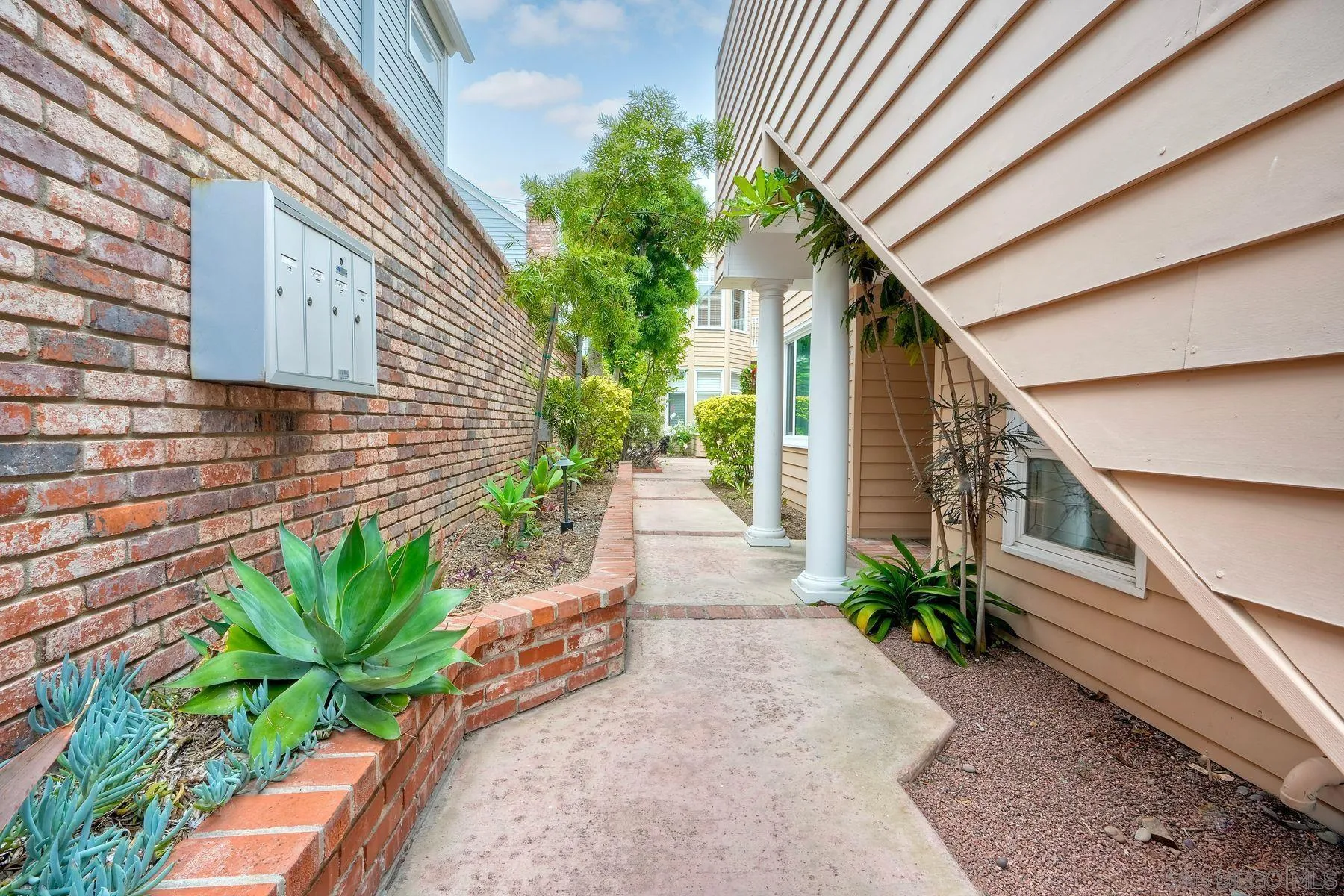 7635 Draper Avenue La Jolla, CA 92037 - Photo 15 of 43 a house with potted plants in front of it