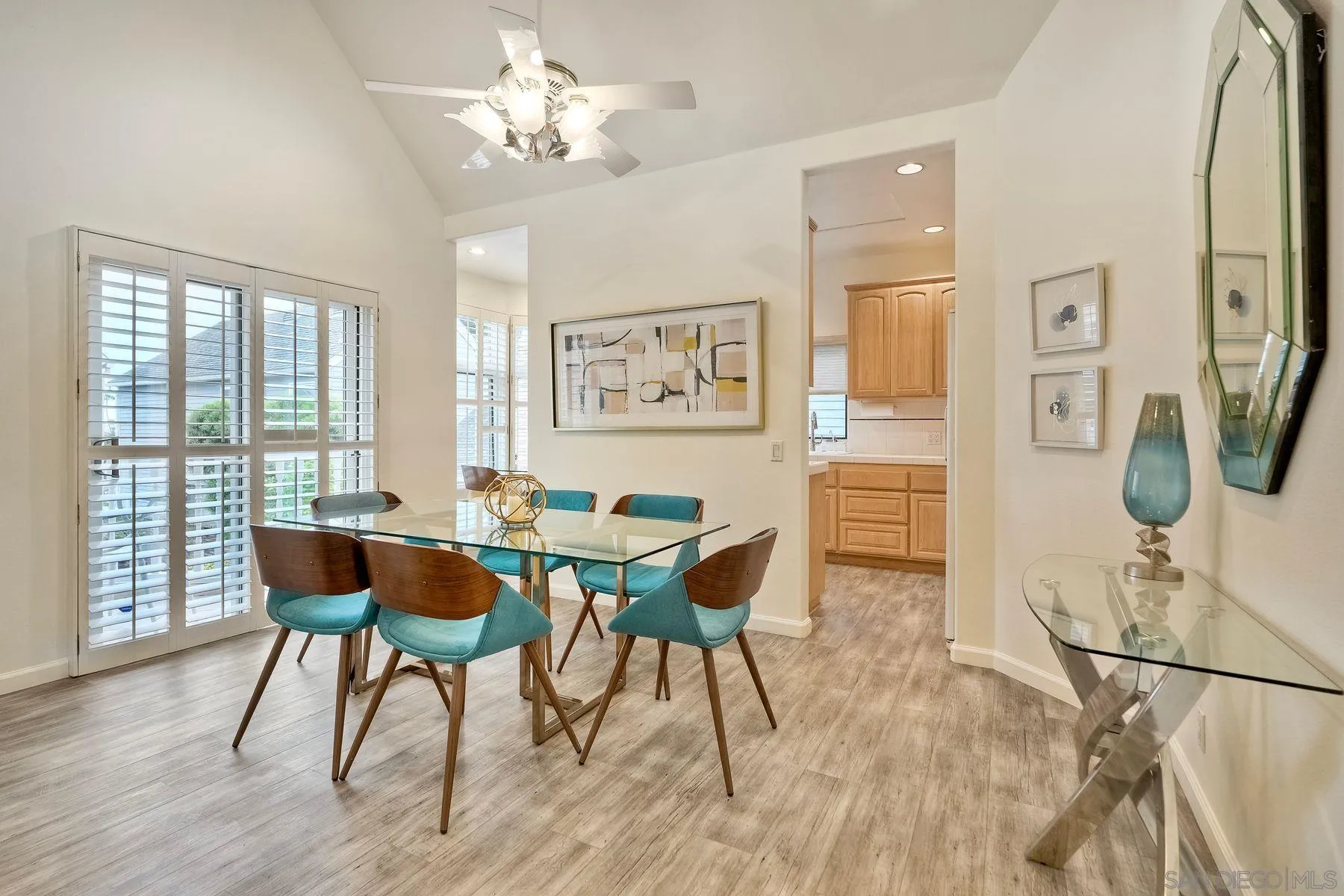 7635 Draper Avenue La Jolla, CA 92037 - Photo 21 of 43 a dining room with furniture a window and wooden floor