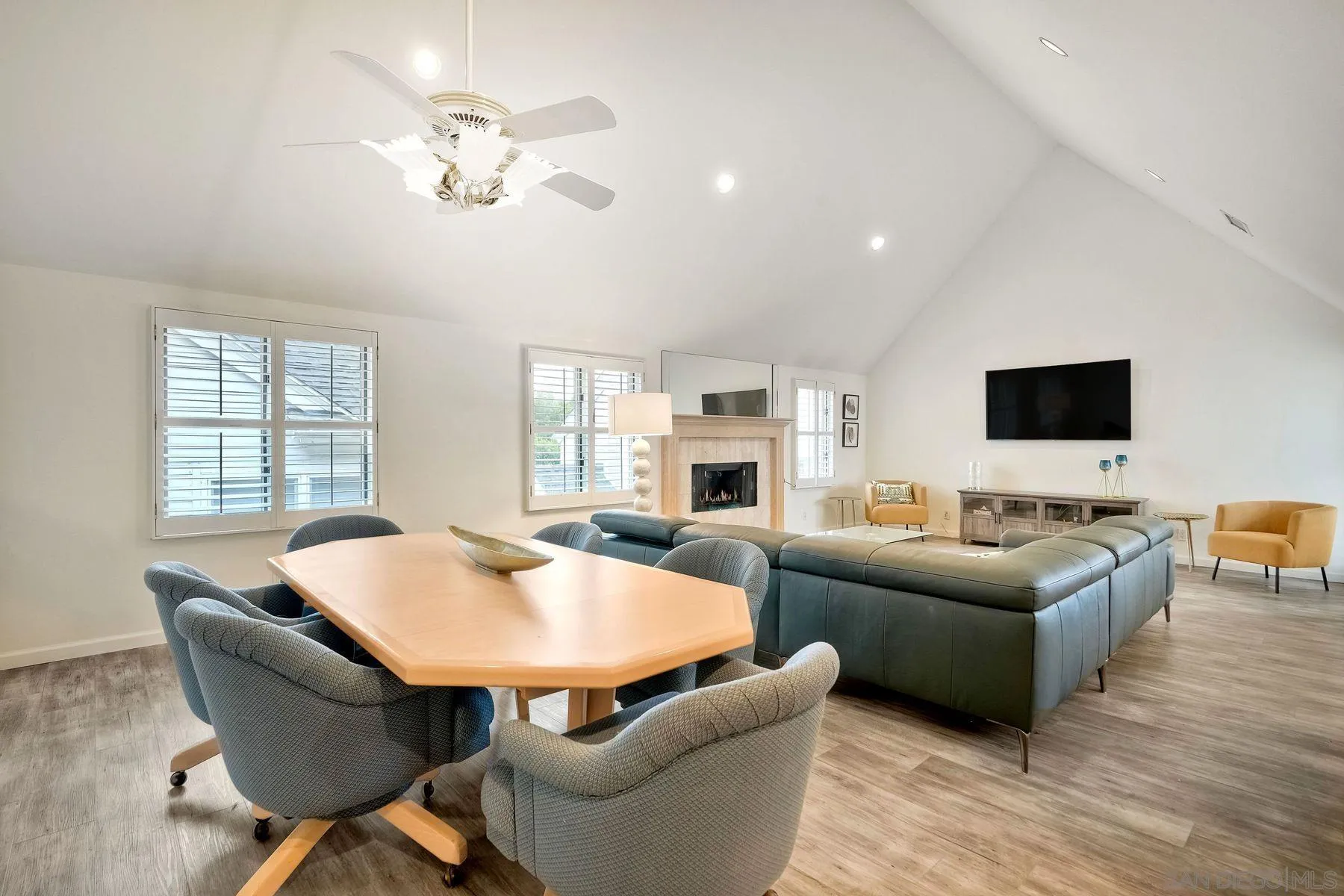 7635 Draper Avenue La Jolla, CA 92037 - Photo 22 of 43 a living room with furniture a fireplace and a flat screen tv