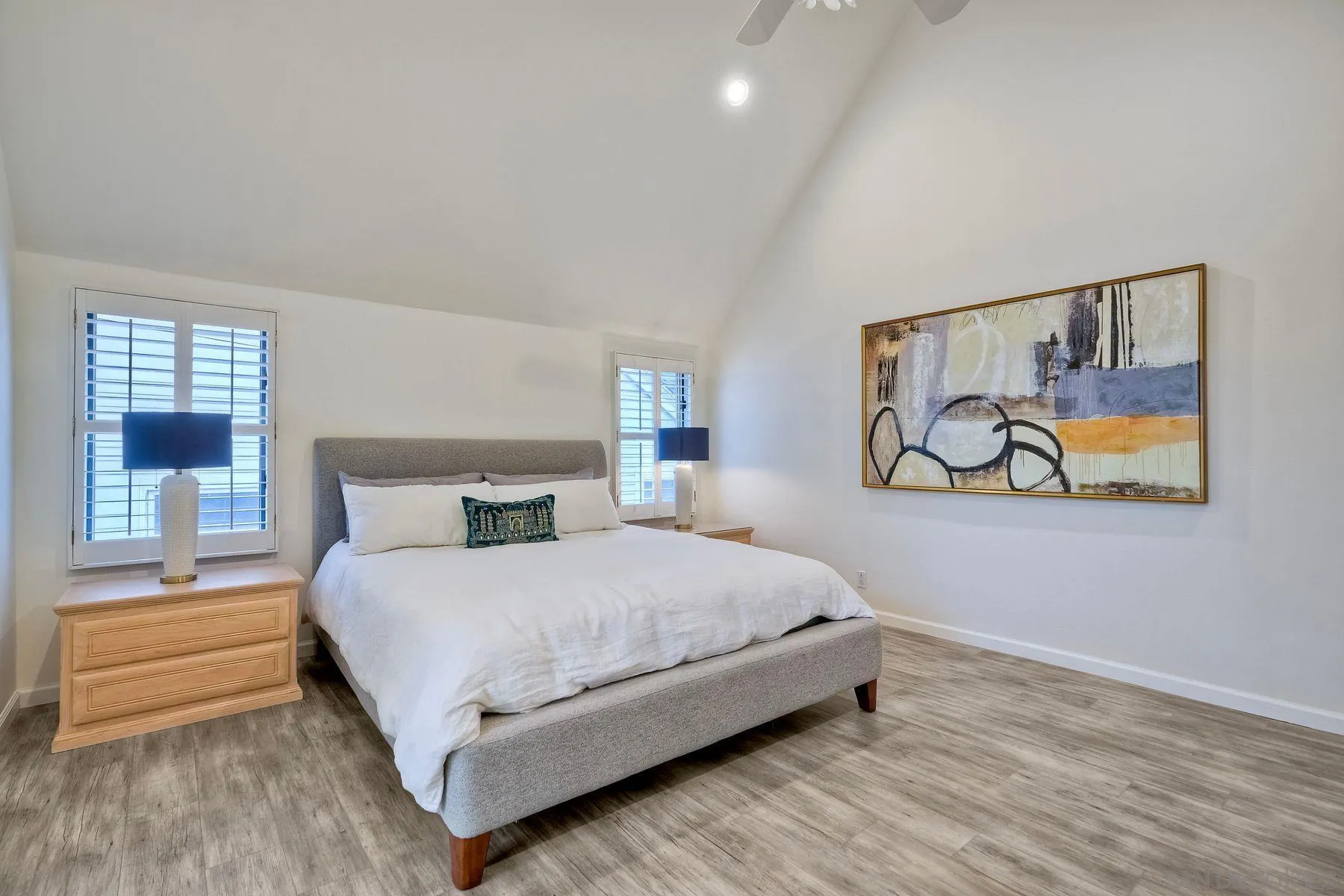 7635 Draper Avenue La Jolla, CA 92037 - Photo 28 of 43 a bedroom with a bed and a painting on the wall