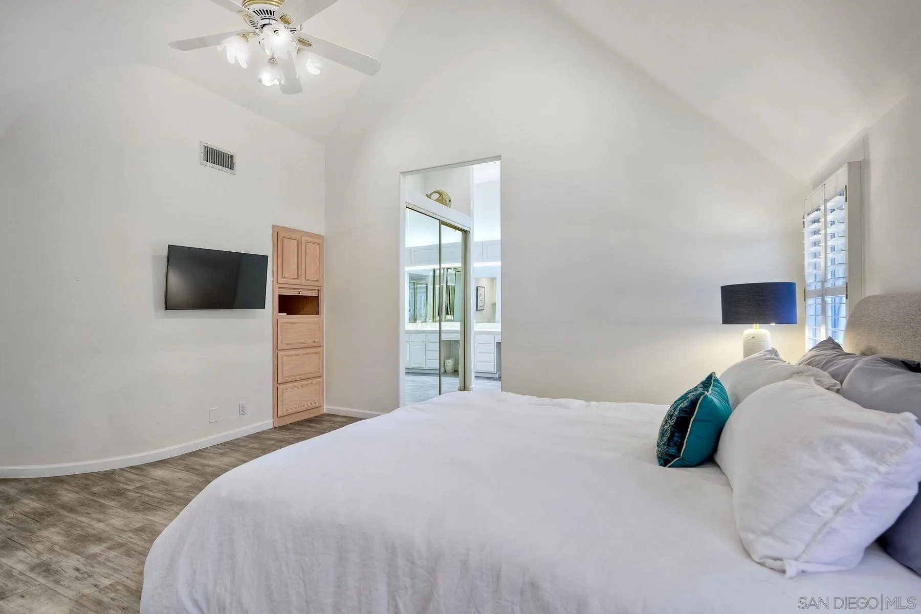 7635 Draper Avenue La Jolla, CA 92037 - Photo 29 of 43 a bedroom with a bed and a flat screen tv