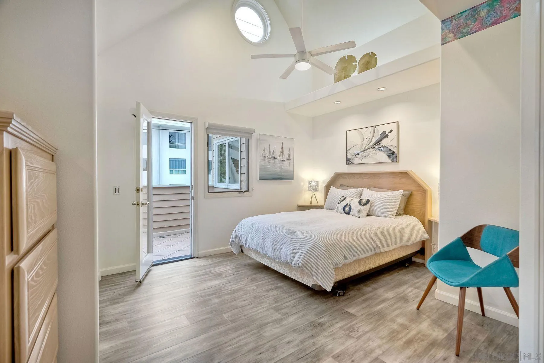 7635 Draper Avenue La Jolla, CA 92037 - Photo 34 of 43 a bedroom with a bed lamp and a window