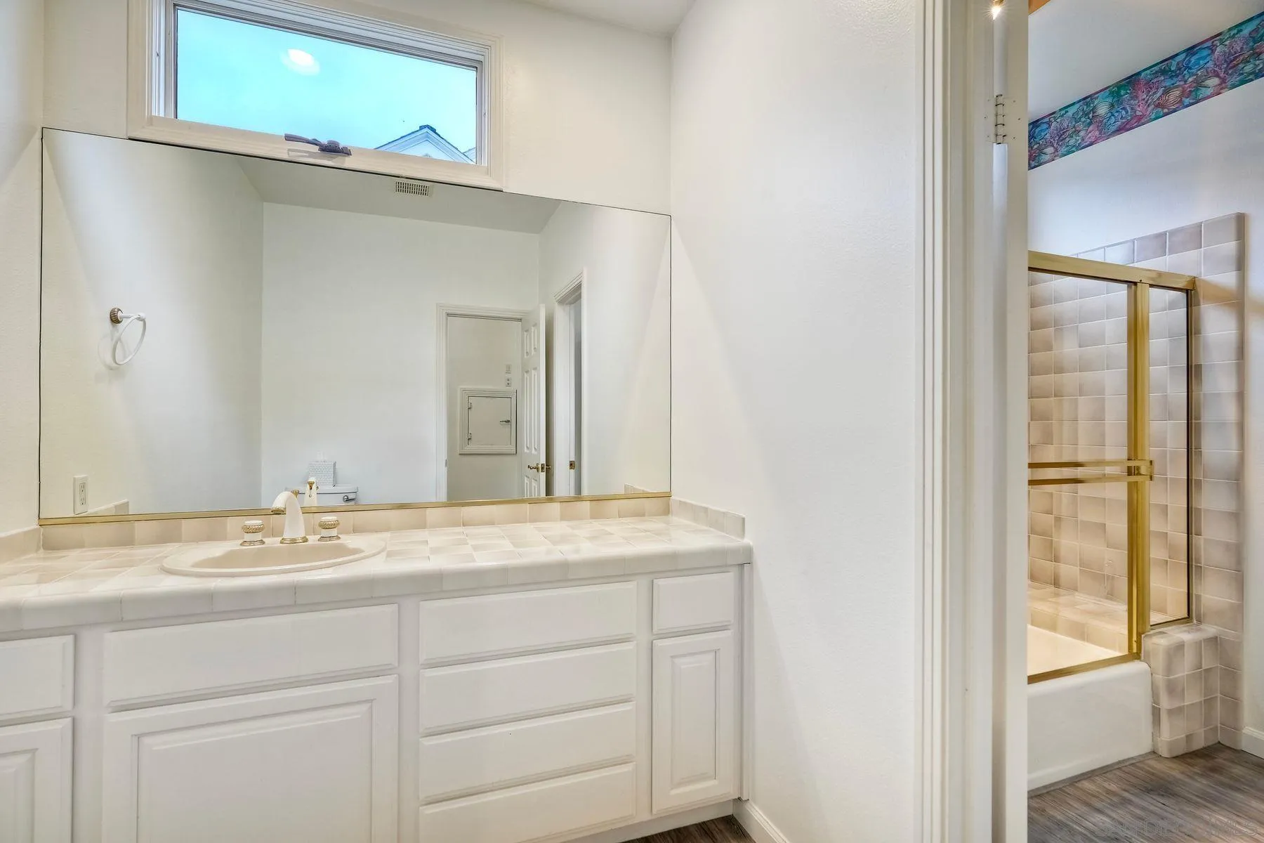 7635 Draper Avenue La Jolla, CA 92037 - Photo 36 of 43 a bathroom with a granite countertop sink and mirror