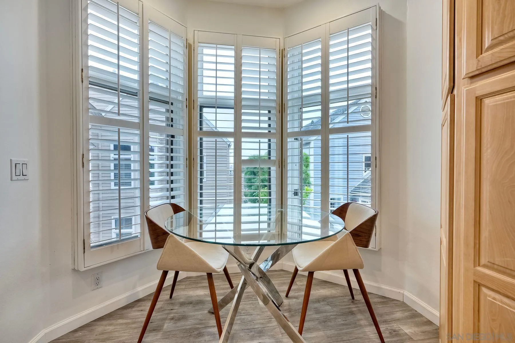 7635 Draper Avenue La Jolla, CA 92037 - Photo 39 of 43 a dining room with furniture and wooden floor