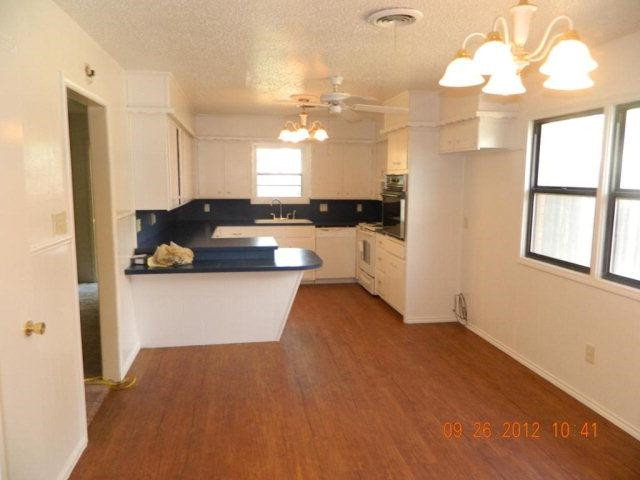 6902 Flint Avenue Lubbock, TX 79413 - Photo 7 of 10 a view of a house with a kitchen