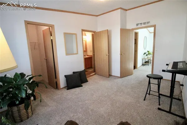 a view of a livingroom with furniture and a window