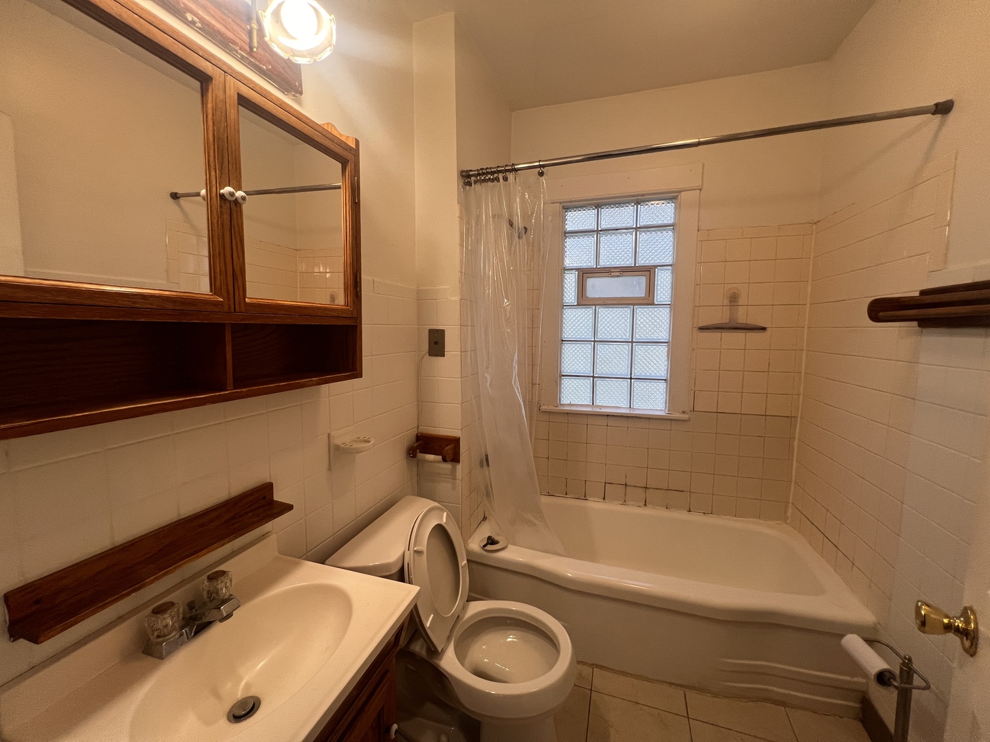 18451 Klimm Avenue Homewood, IL 60430 - Photo 11 of 15 a bathroom with a sink a toilet and shower
