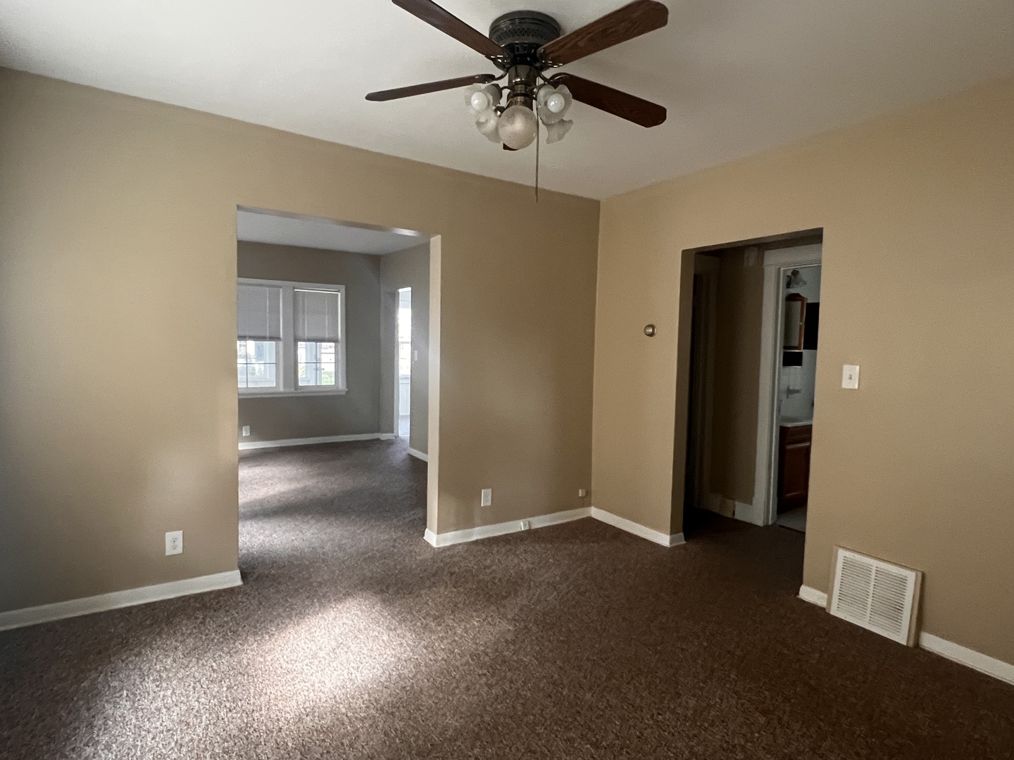 18451 Klimm Avenue Homewood, IL 60430 - Photo 6 of 15 an empty room with windows and fan