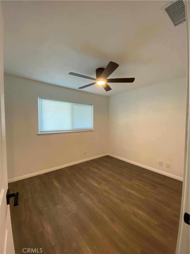 1313 West Avenue Fullerton, CA 92833 - Photo 11 of 20 a view of an empty room with wooden floor and a window