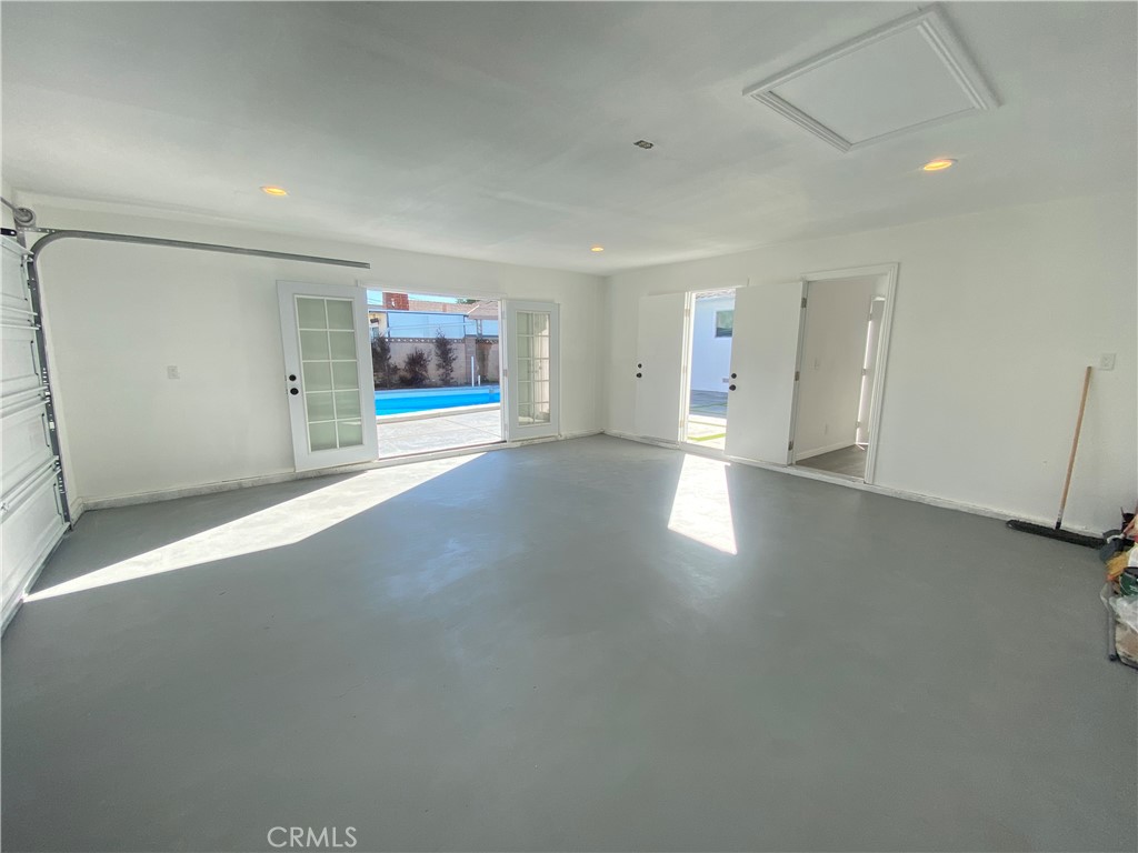 1313 West Avenue Fullerton, CA 92833 - Photo 18 of 20 an empty room with a window and a projector screen