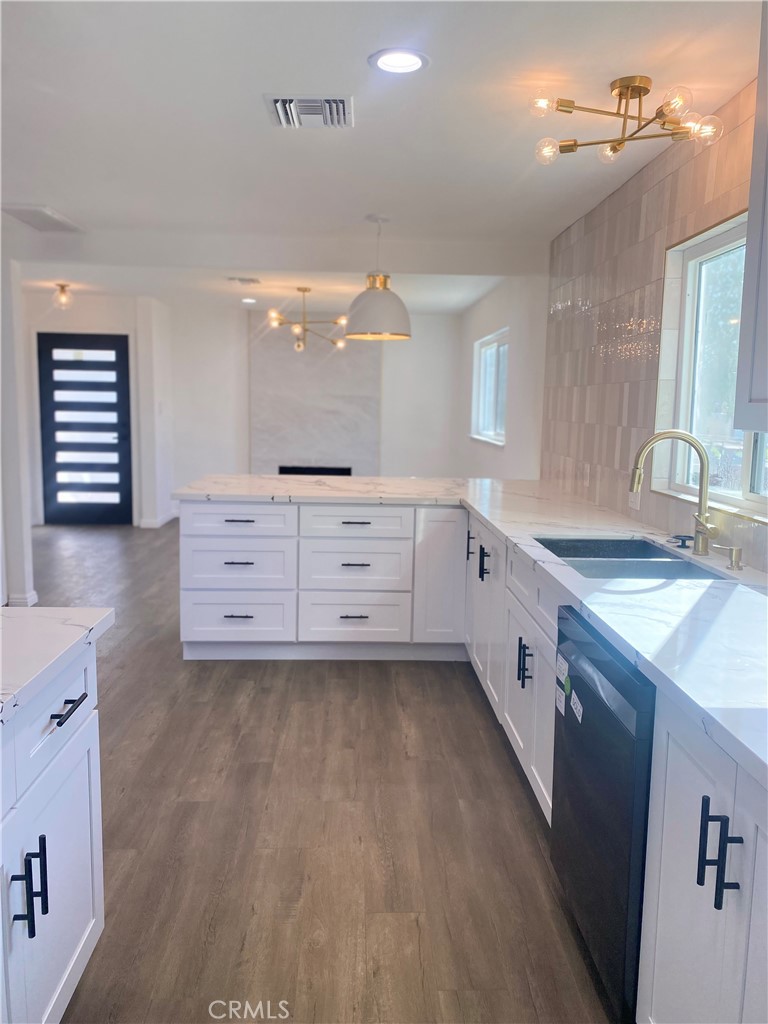 1313 West Avenue Fullerton, CA 92833 - Photo 3 of 20 a spacious bathroom with a granite countertop sink and a mirror