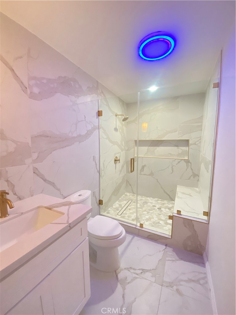 1313 West Avenue Fullerton, CA 92833 - Photo 6 of 20 a bathroom with a sink a toilet and shower