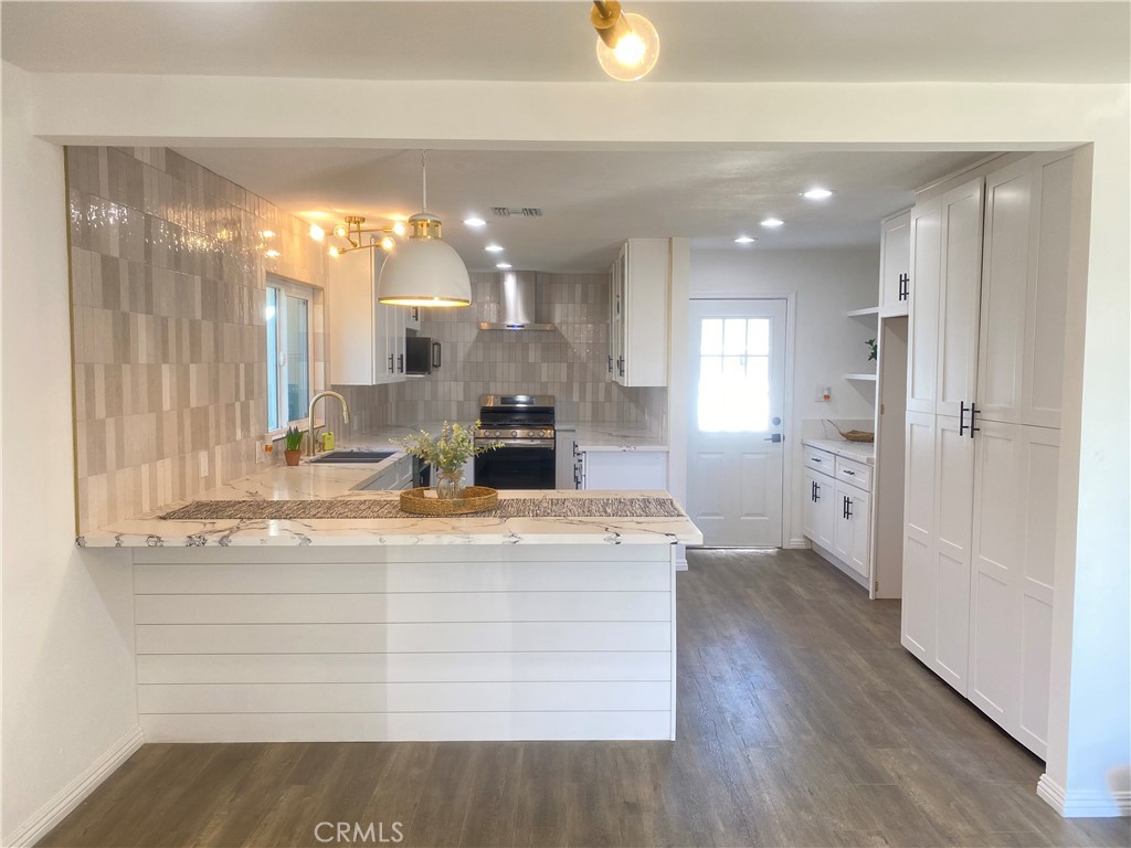 1313 West Avenue Fullerton, CA 92833 - Photo 9 of 20 a spacious bathroom with a granite countertop sink mirror and shower