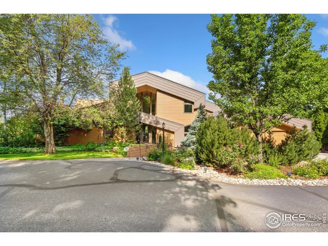 a view of road with a house in the background