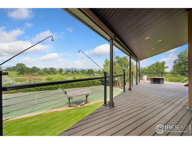 a view of a patio with a table and chairs