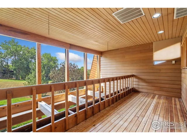 a living room with a table and a large window