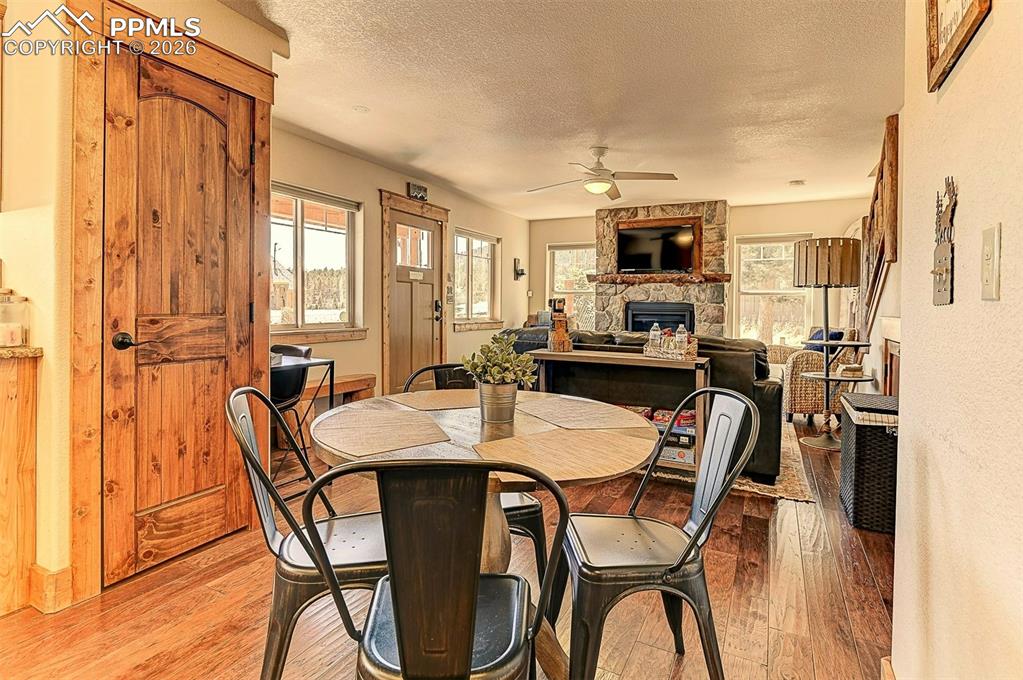 140 Dewell Road Woodland Park, CO 80863 - Photo 12 of 28 a view of a dining room with furniture window and wooden floor