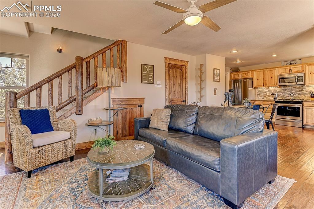 140 Dewell Road Woodland Park, CO 80863 - Photo 17 of 28 a living room with furniture and a dining table