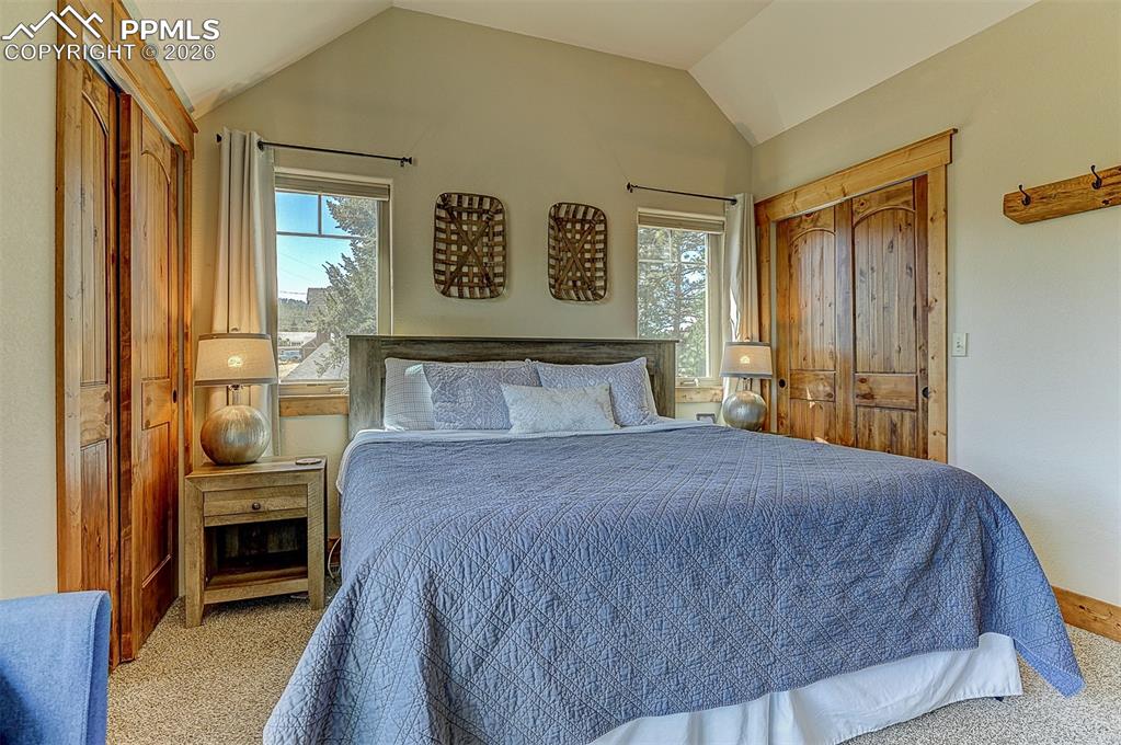 140 Dewell Road Woodland Park, CO 80863 - Photo 24 of 28 a bedroom with a bed and a window