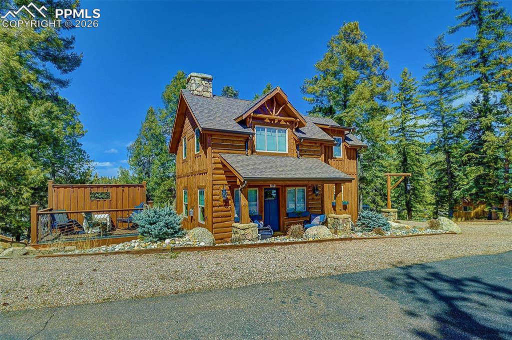 140 Dewell Road Woodland Park, CO 80863 - Photo 3 of 28 a front view of a house with a yard
