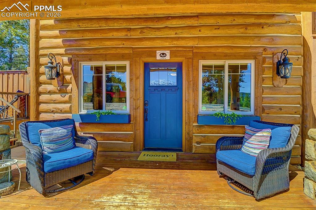 140 Dewell Road Woodland Park, CO 80863 - Photo 5 of 28 a bench sitting in front of a building