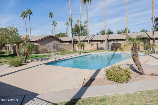 a view of a swimming pool with a lounge chairs