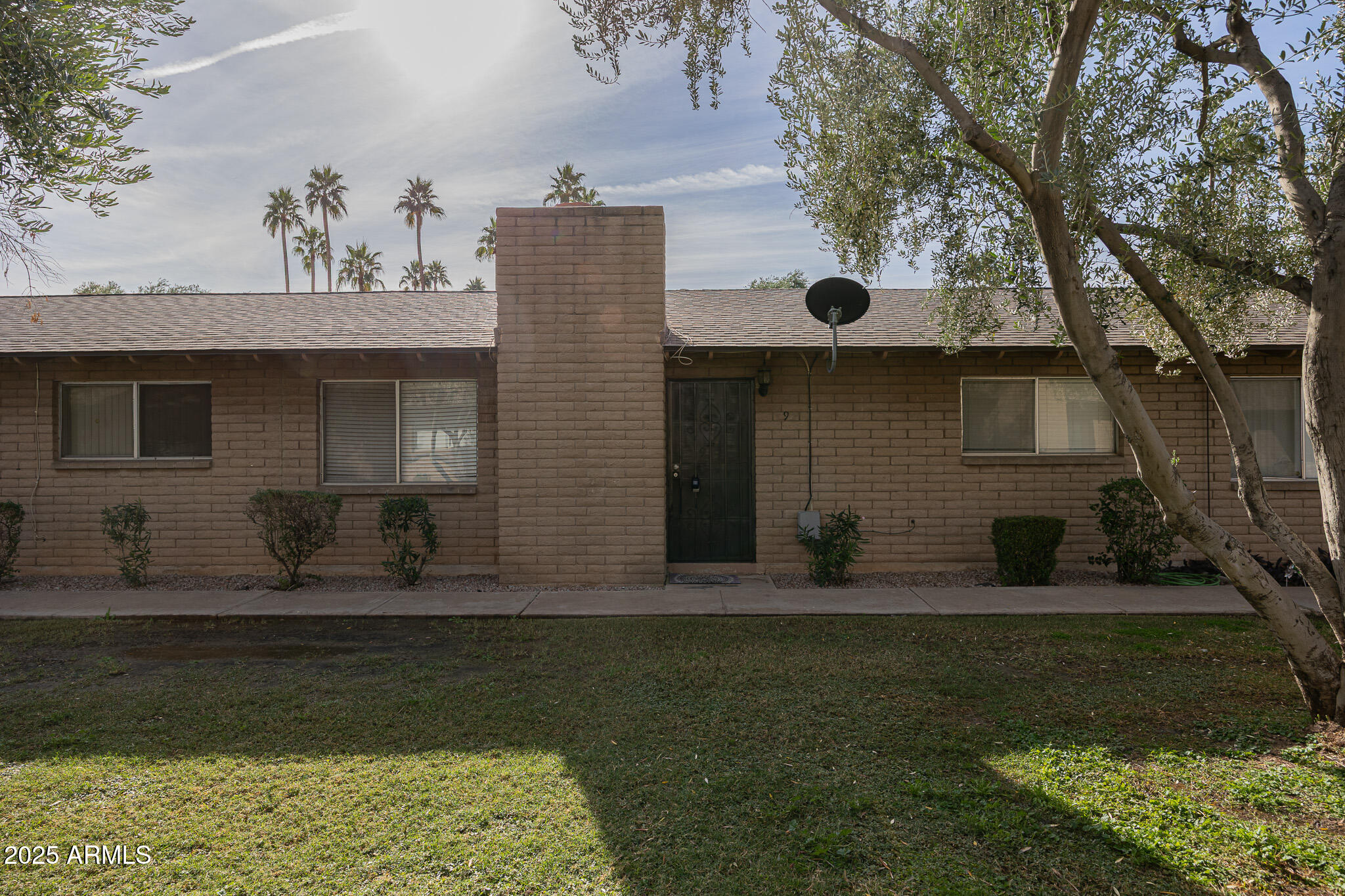 3031 South Rural Road, Unit 9 Tempe, AZ 85282 - Photo 2 of 22 a front view of a house with garden