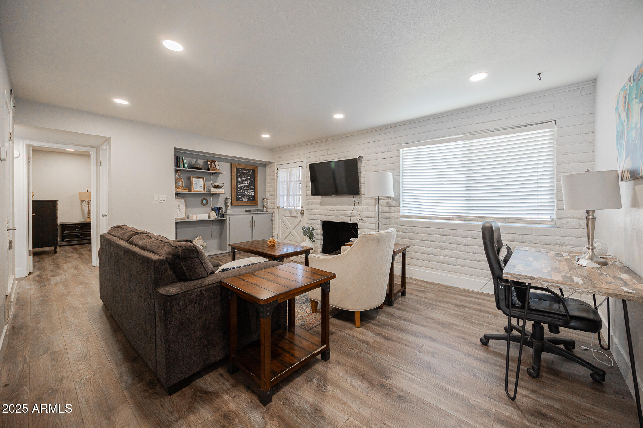 3031 South Rural Road, Unit 9 Tempe, AZ 85282 - Photo 6 of 22 a living room with fireplace furniture and a flat screen tv
