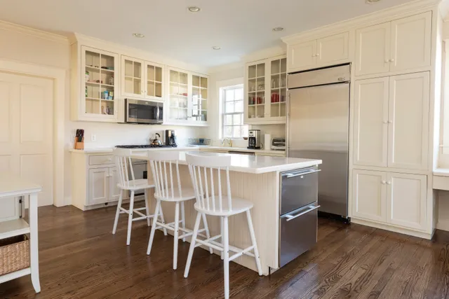 a kitchen with stainless steel appliances a white stove top oven and a refrigerator