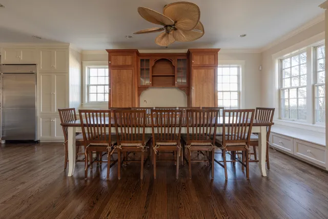 a view of a dining room with furniture window and wooden floor