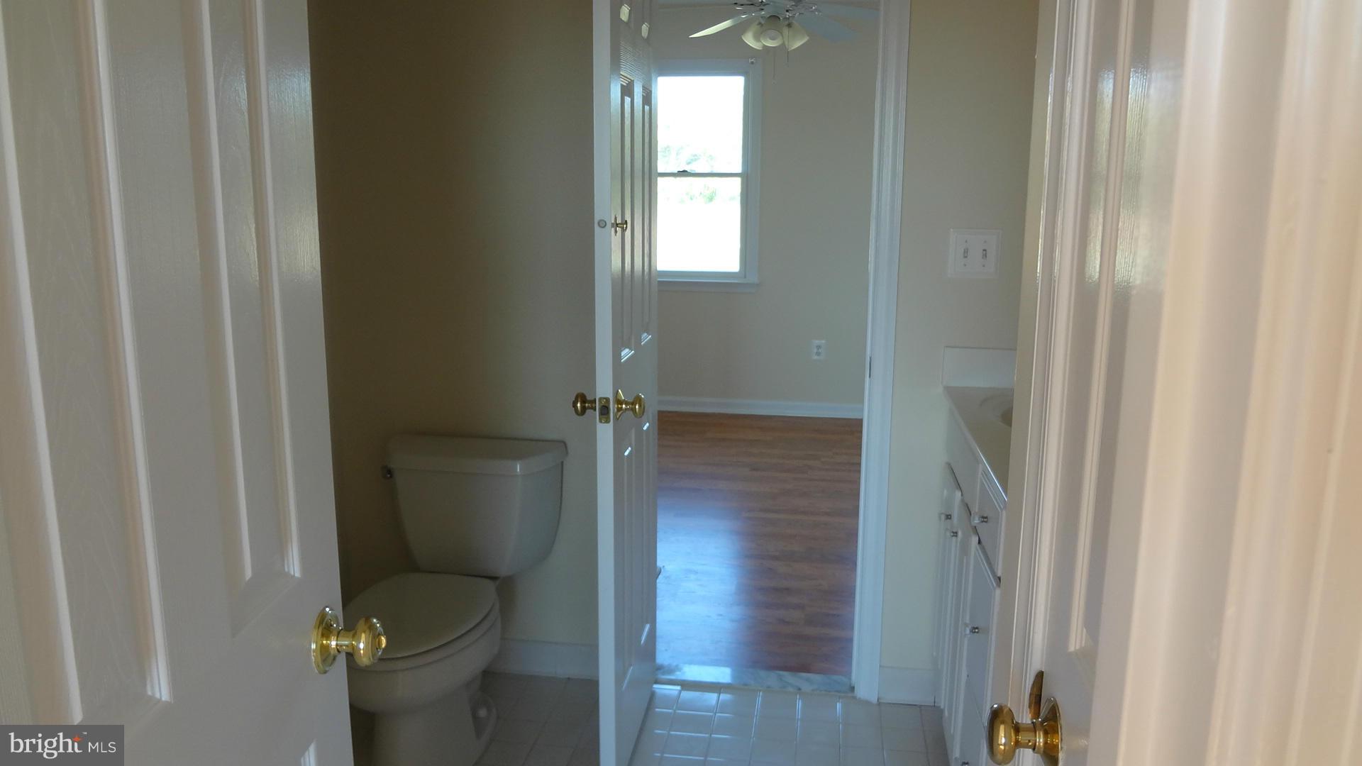 15900 Barnesville Road Boyds, MD 20841 - Photo 15 of 30 a bathroom with a granite countertop sink