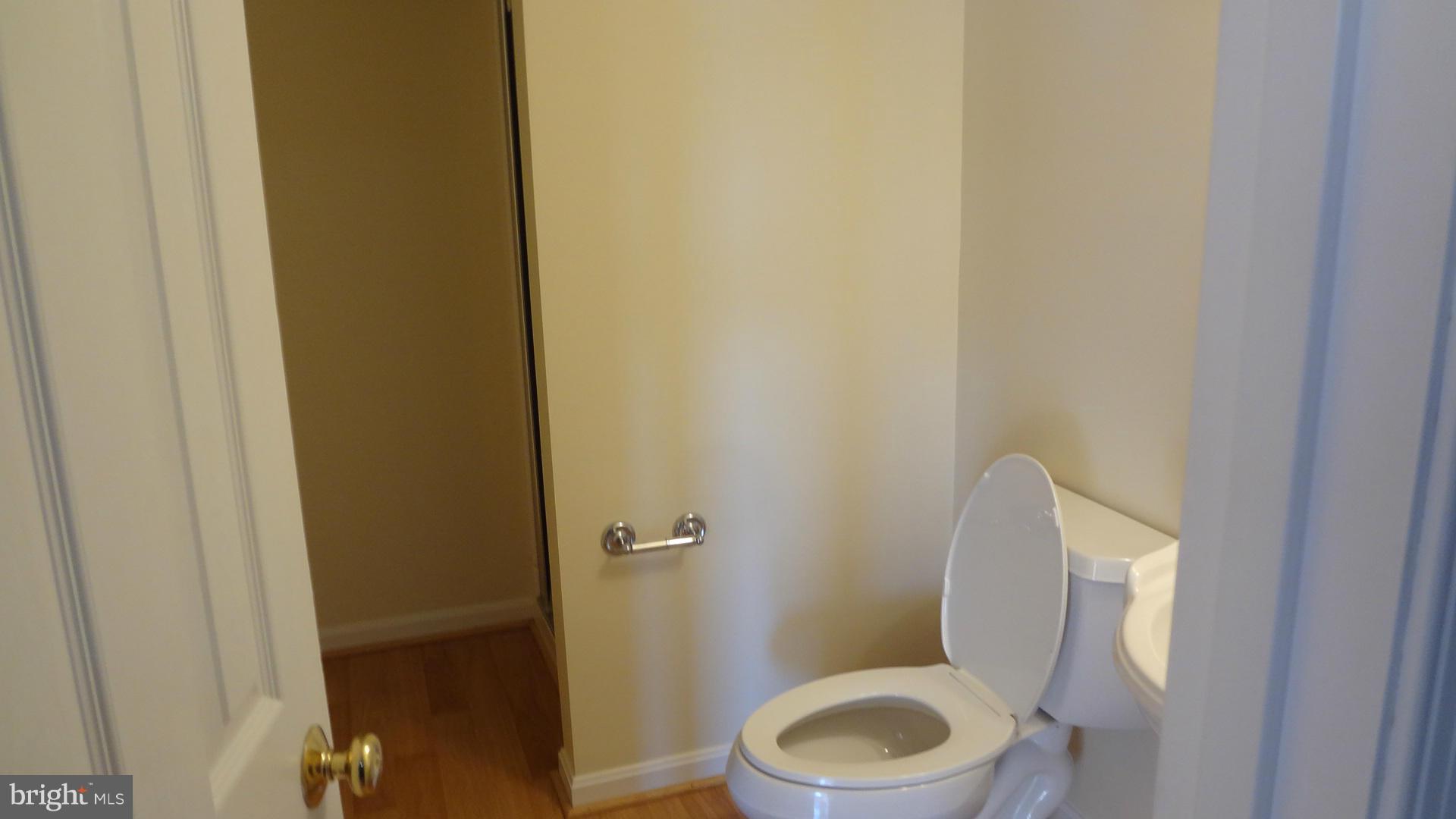 15900 Barnesville Road Boyds, MD 20841 - Photo 24 of 30 a white toilet sitting next to a small bathroom