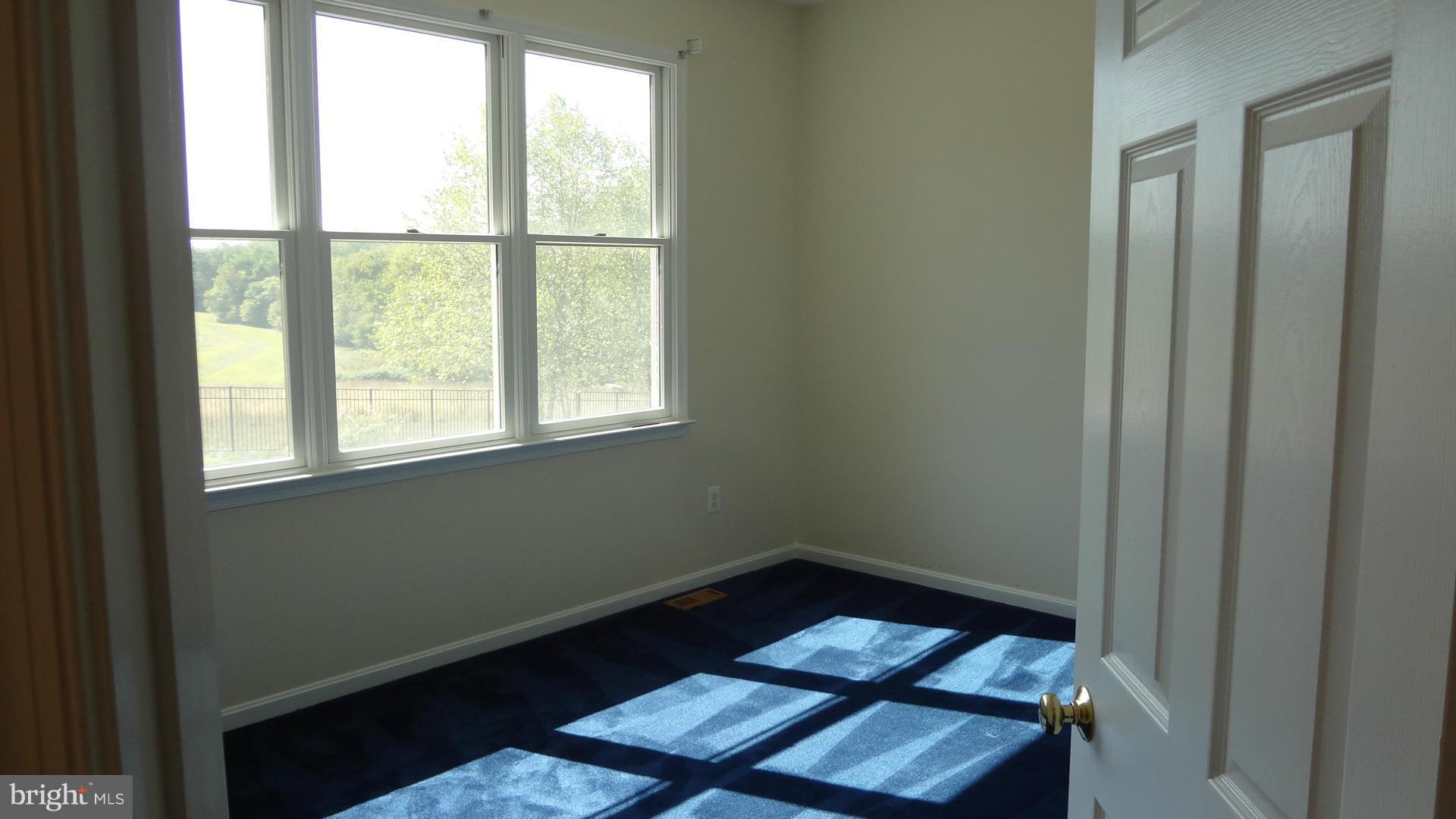 15900 Barnesville Road Boyds, MD 20841 - Photo 8 of 30 a view of a room with wooden floor and windows